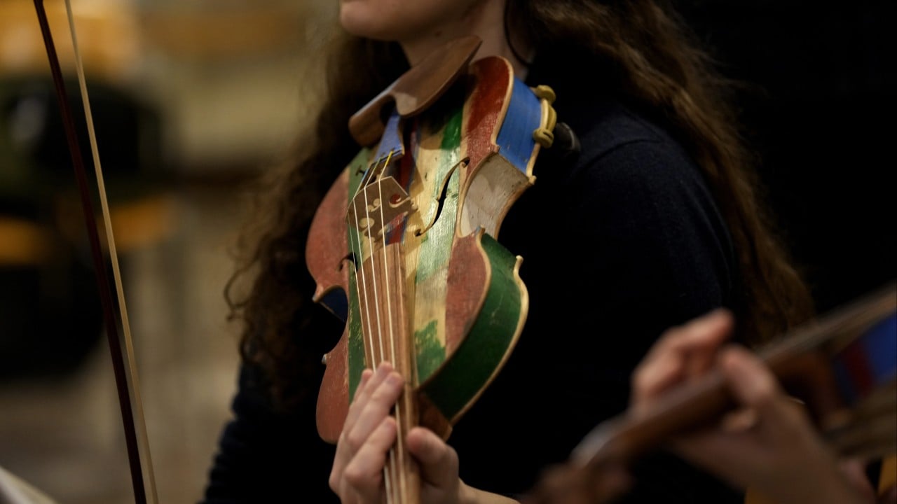 Violins, cellos and violas made by prisoners from wood recovered from people smugglers’ boats take their bow in La Scala concert