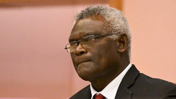 Solomon's pro-China PM retains seat, vote continues