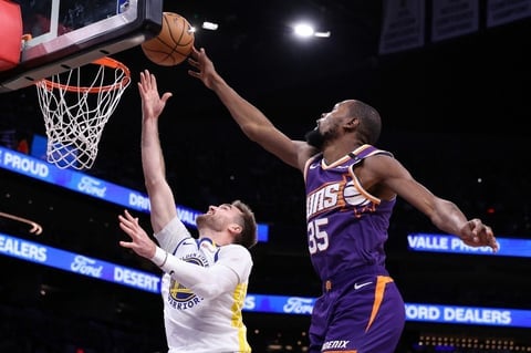 Durant and Booker lead NBA Suns over Warriors